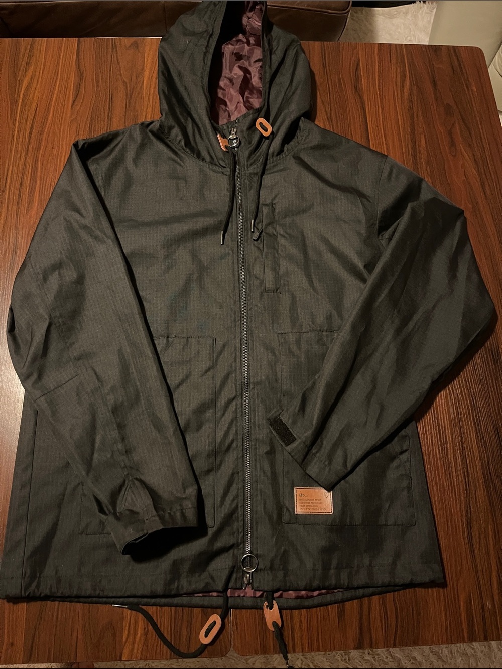 Men's Black Imperial Motion Jacket with wine colored lining. Size Large.